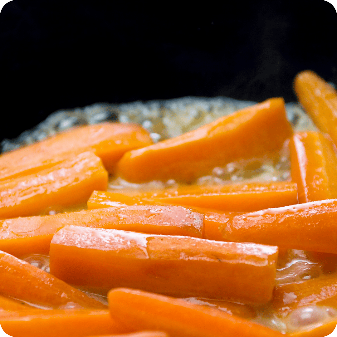 chopped carrots frying in oil
