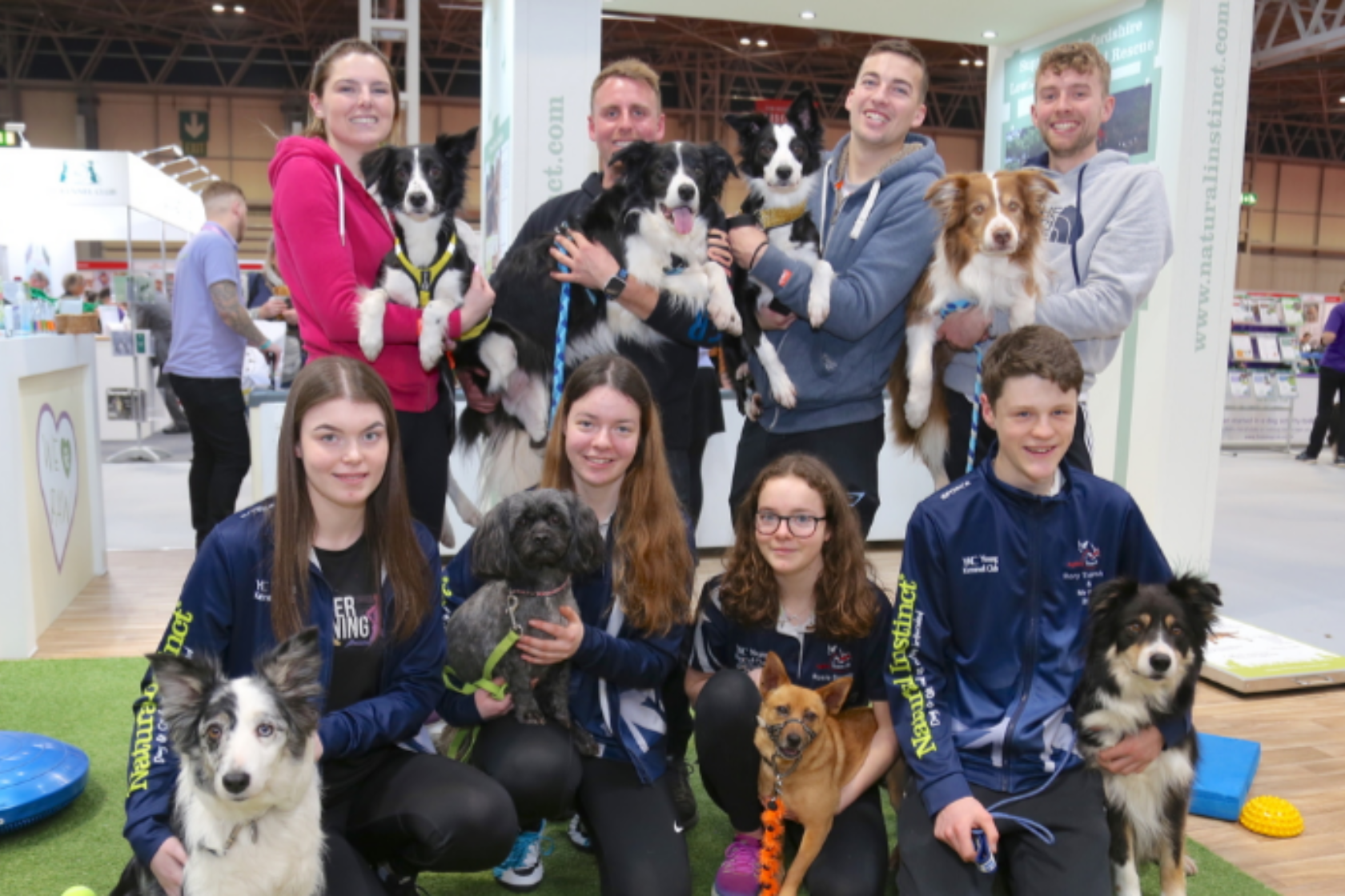 World Class Agility Trainer and Valued Member of Agility Team GB, Dave Munnings with a group of people and their dogs