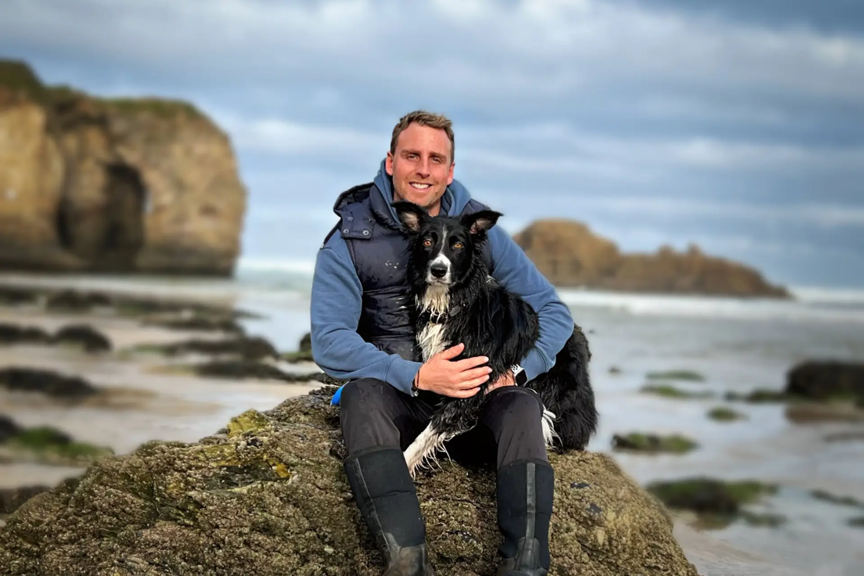 World-class agility trainer Dave Munnings on a sandy beach with his dog